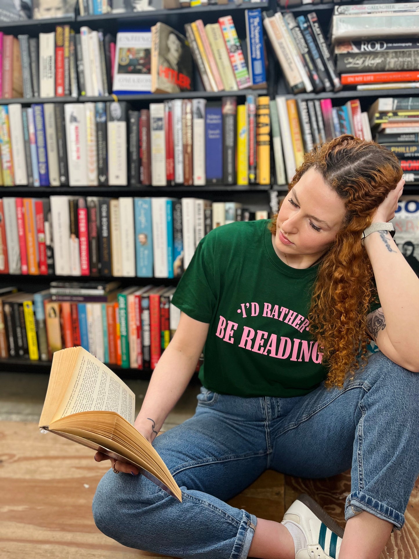 I’d rather be reading t-shirt on a model in green with pink text.