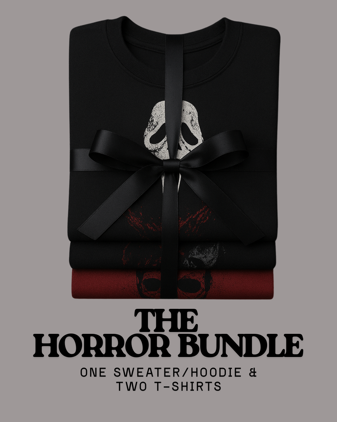 Flat lay of horror mystery bundle – one black horror sweater and two graphic horror t-shirts, hand-printed spooky streetwear.