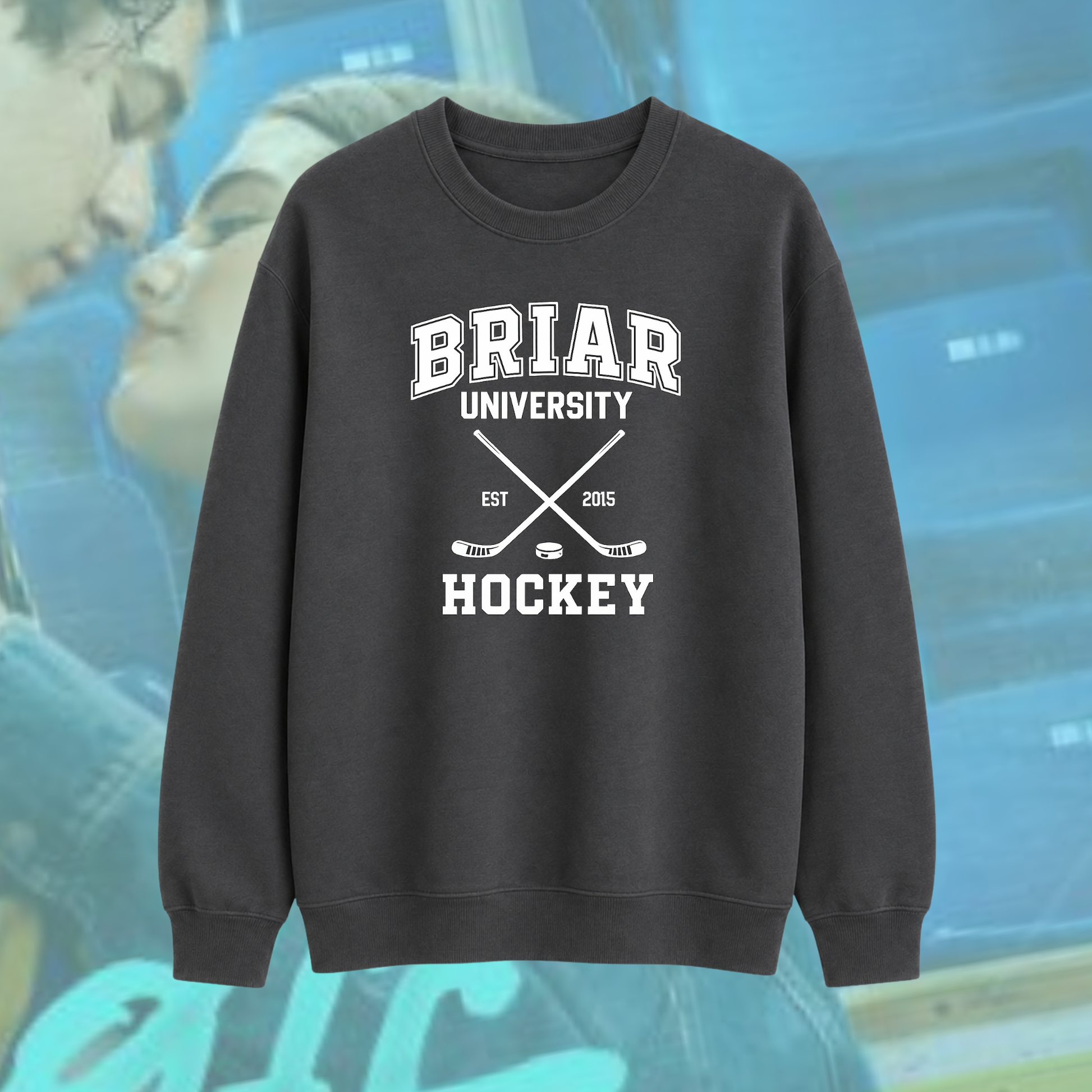 Dark gray sweatshirt with 'Briar University Hockey' text and graphics on a blurred background