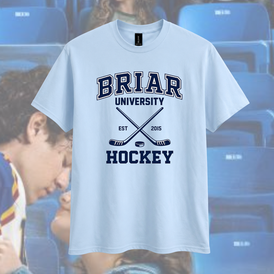 White t-shirt with 'BRIAR UNIVERSITY HOCKEY' text and graphics on a blurred background